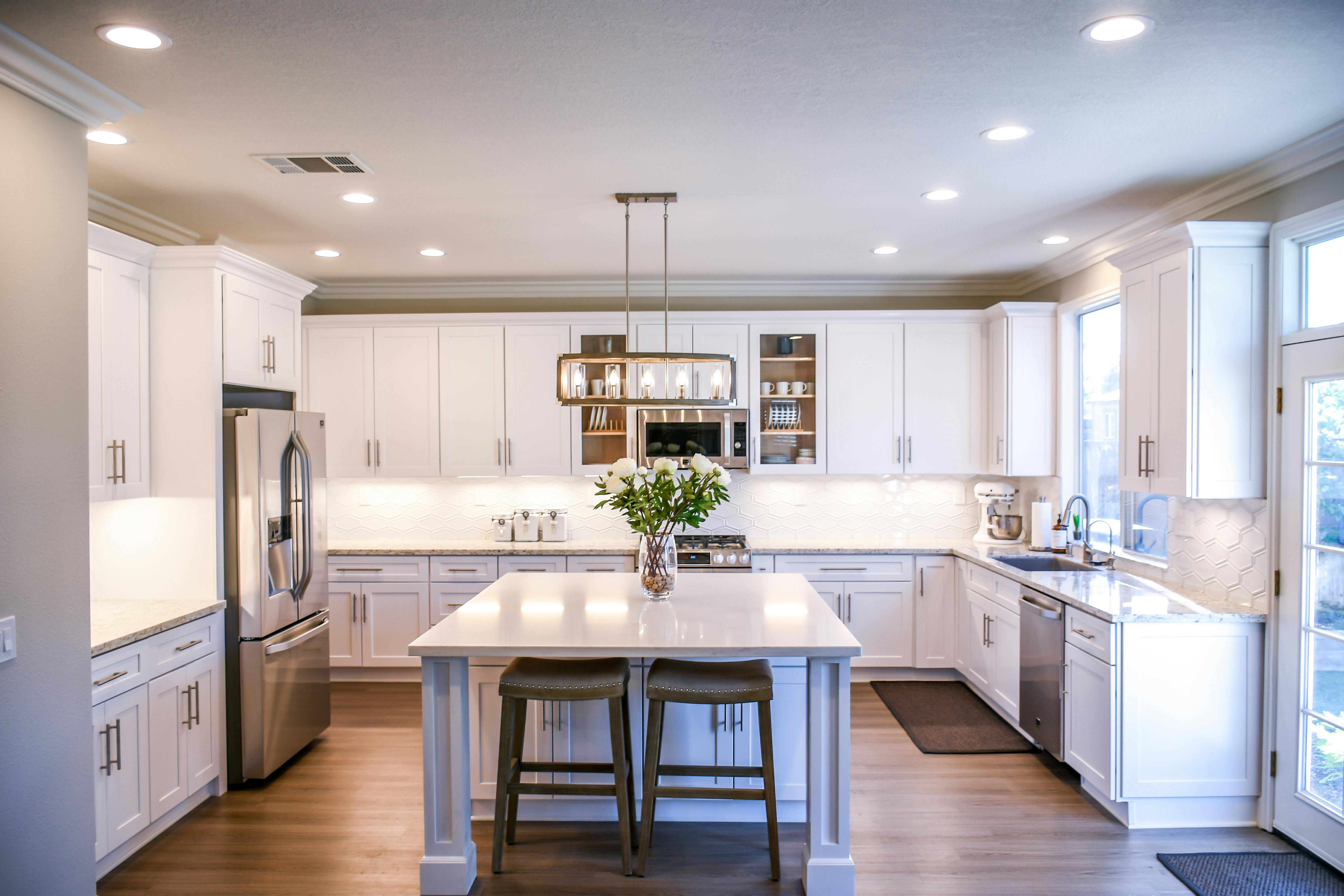 Modern white kitchen with custom cabinets and center island